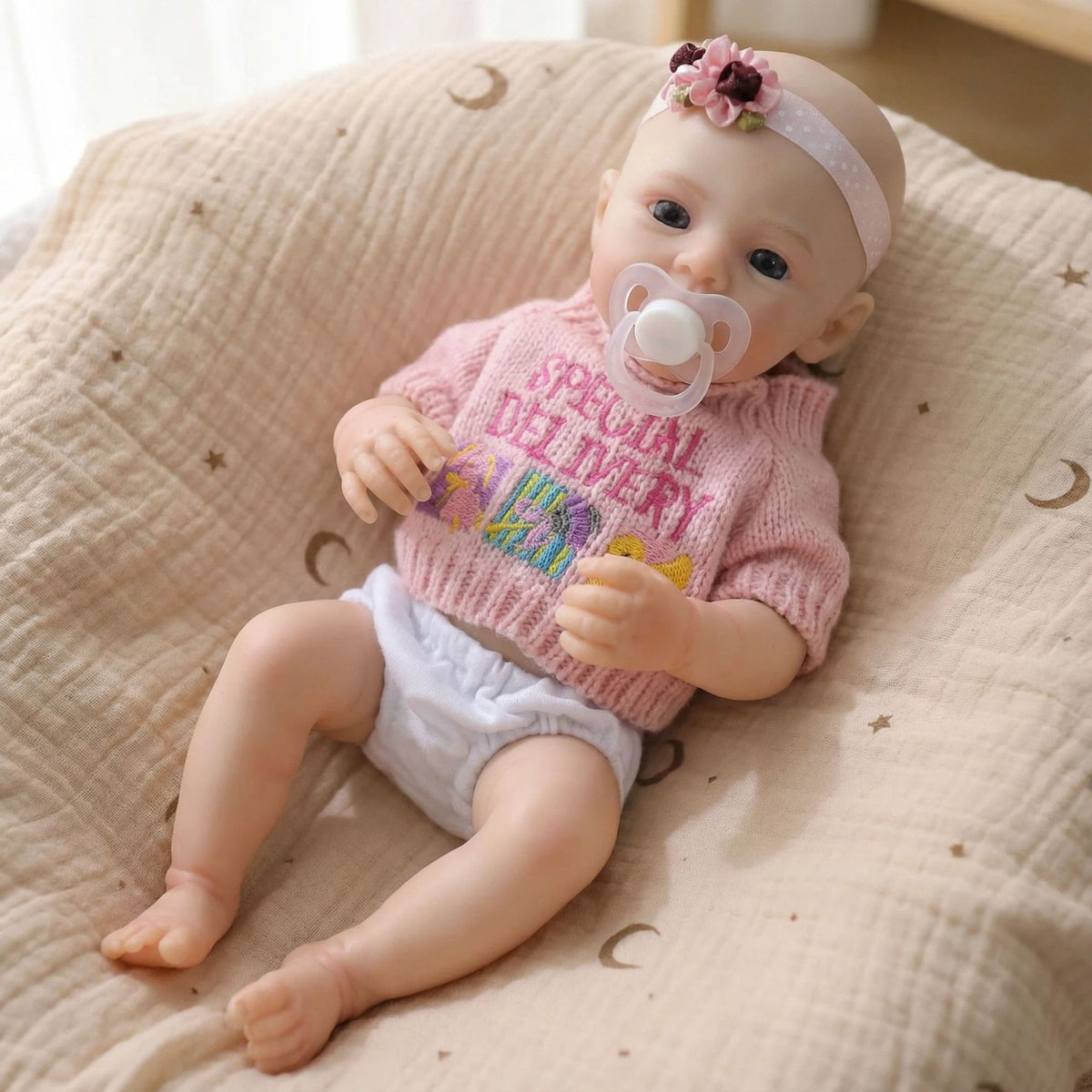 12 inch pink sweater top with meadow solid silicone reincarnation doll as a Christmas gift for children